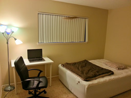 All done — inflatable bed with a mattress pad, table, chair and light.